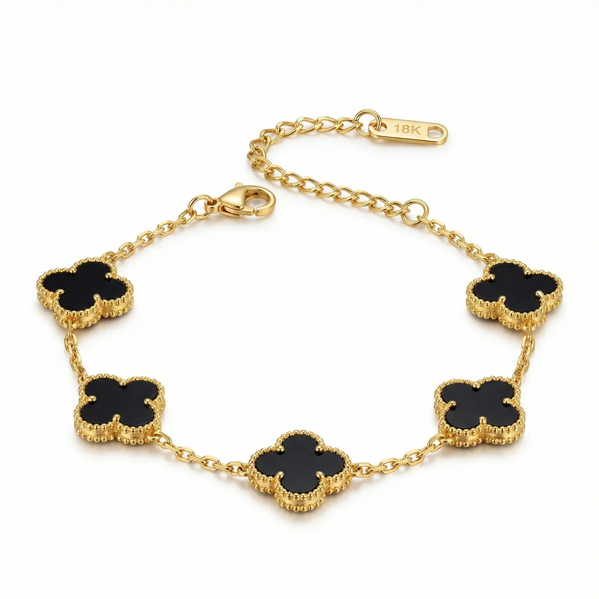 18k gold bracelet with black clover-shaped charms on delicate chain, jewelry product