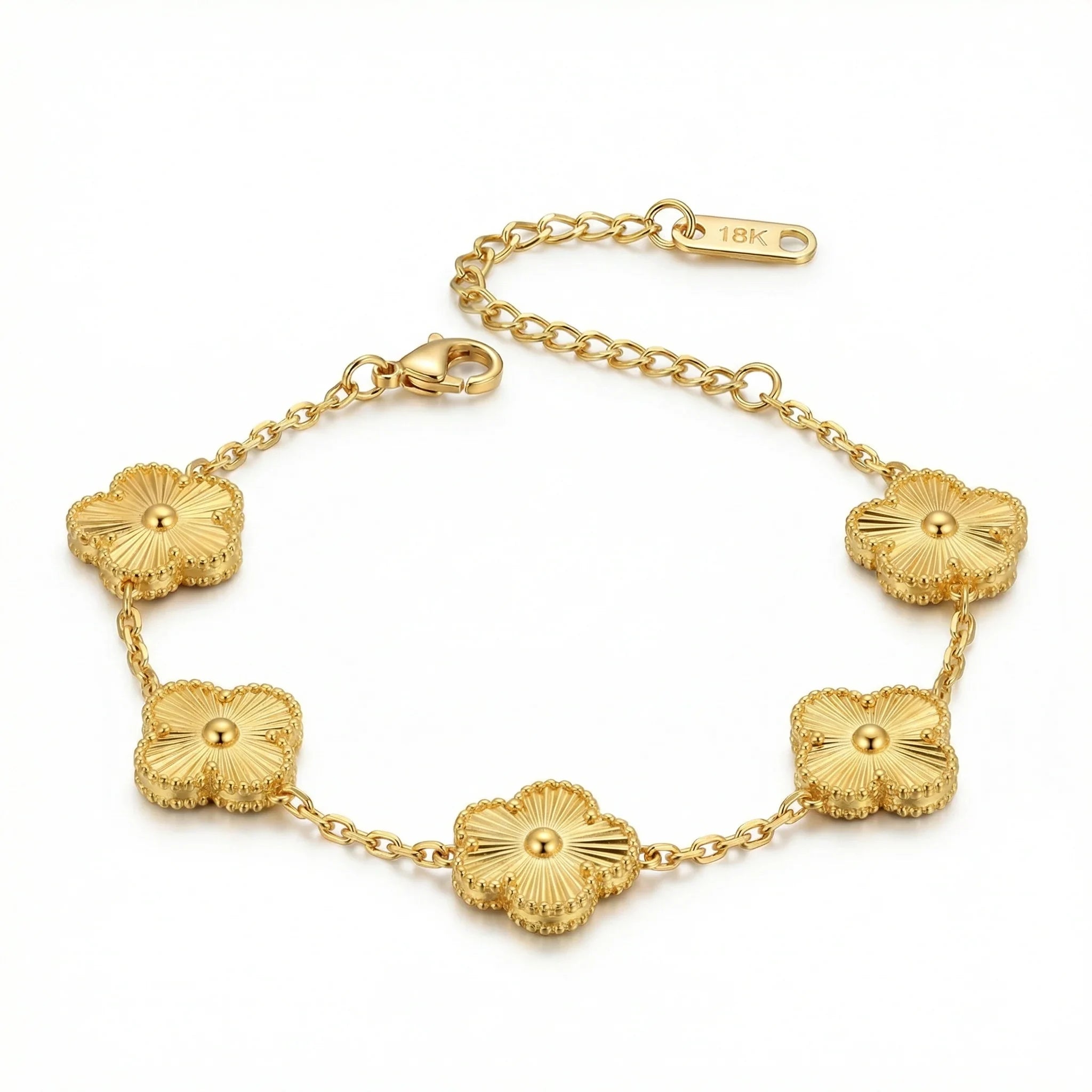 18K gold bracelet with five textured flower charms on a gold chain