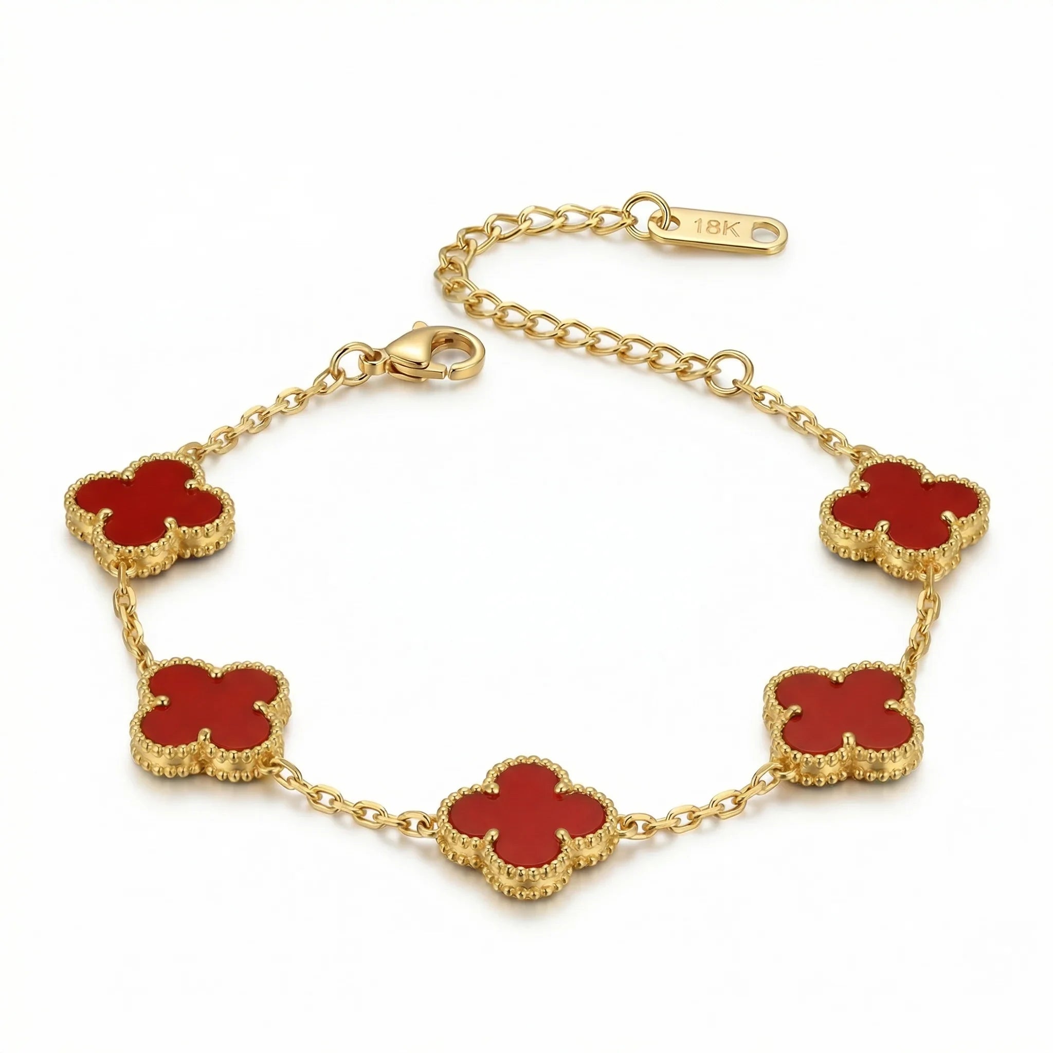 18K gold bracelet with red clover-shaped charms on a delicate chain