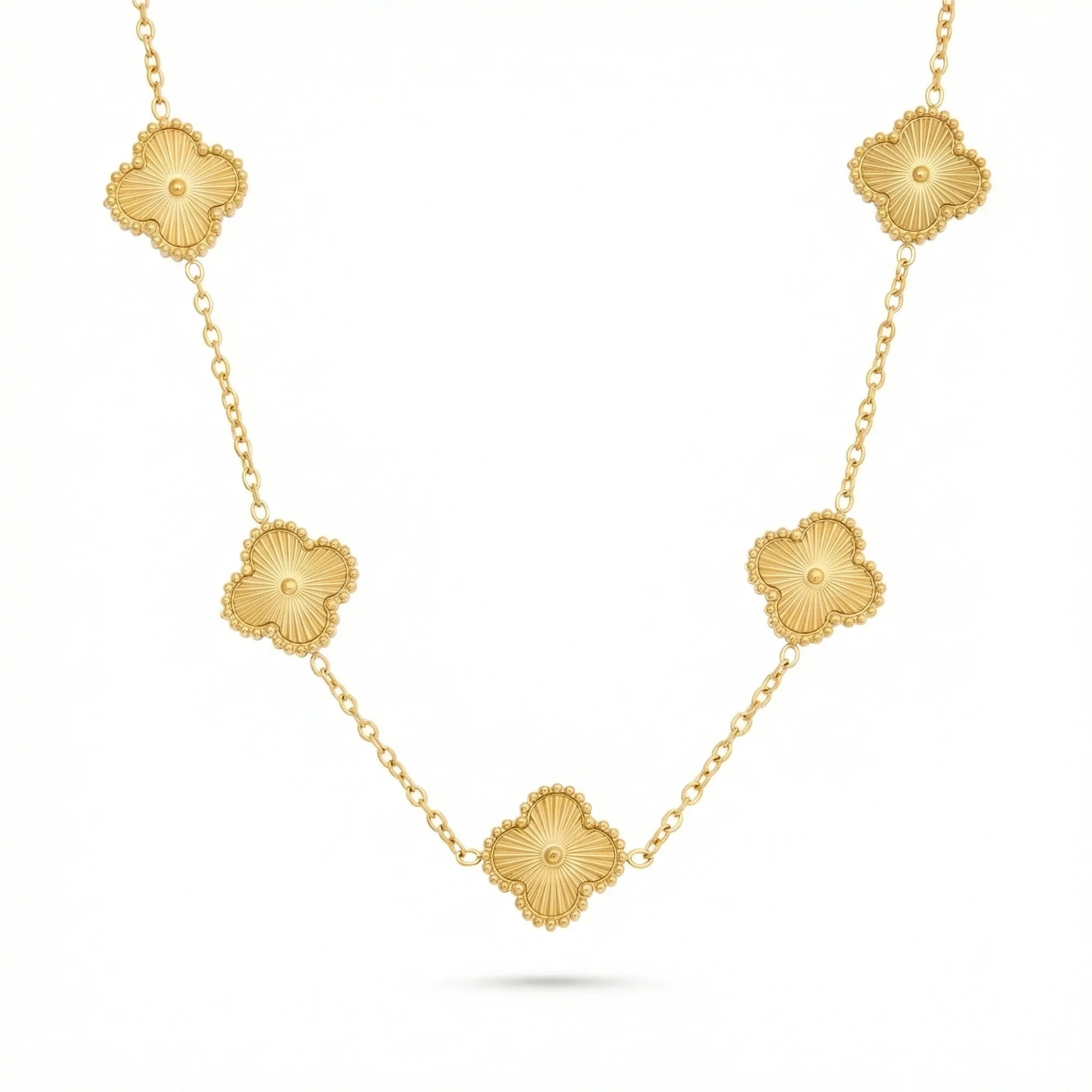 Gold necklace with floral-shaped clover pendants on a delicate chain, jewelry product