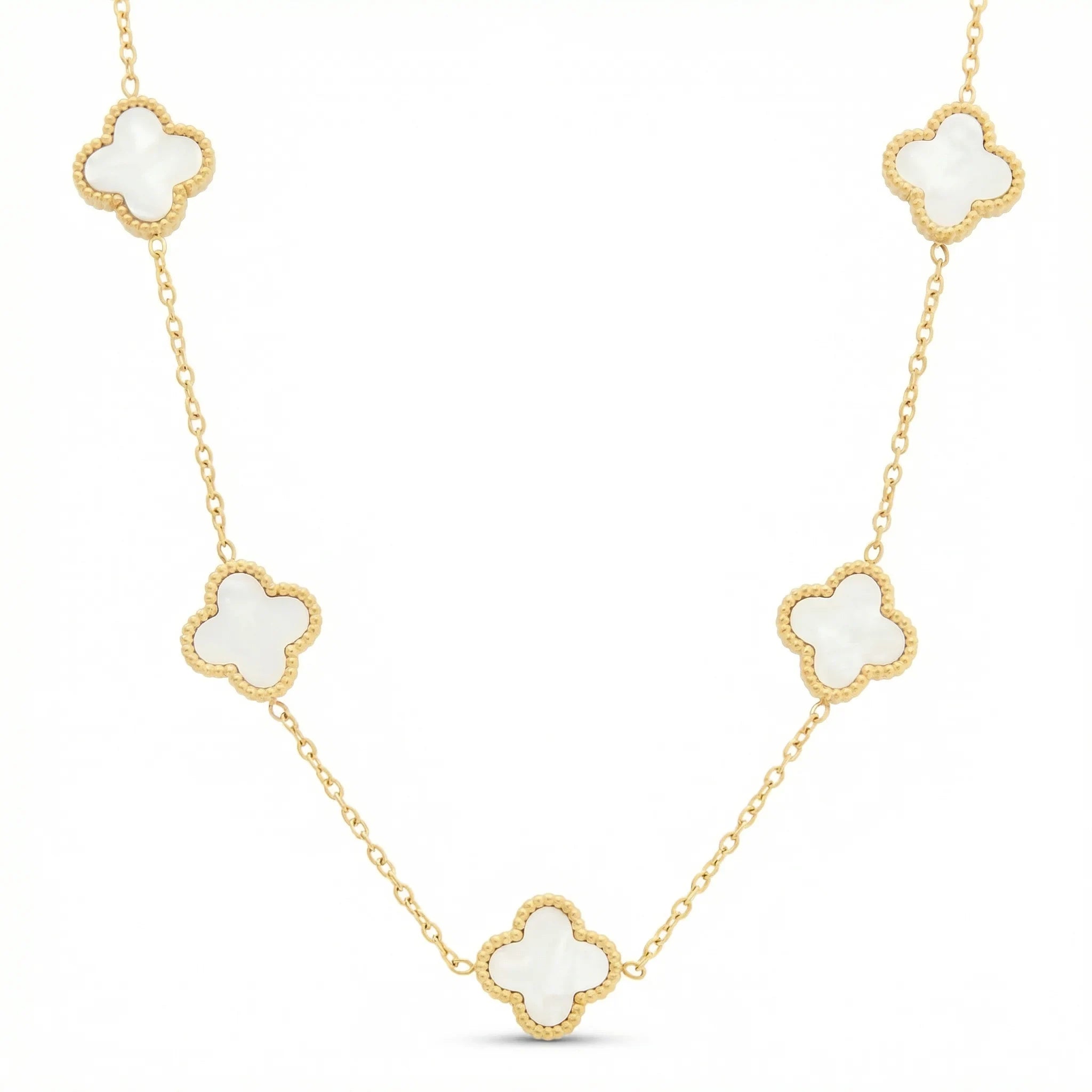 Gold necklace with white clover-shaped charms on a fine chain, elegant jewelry design