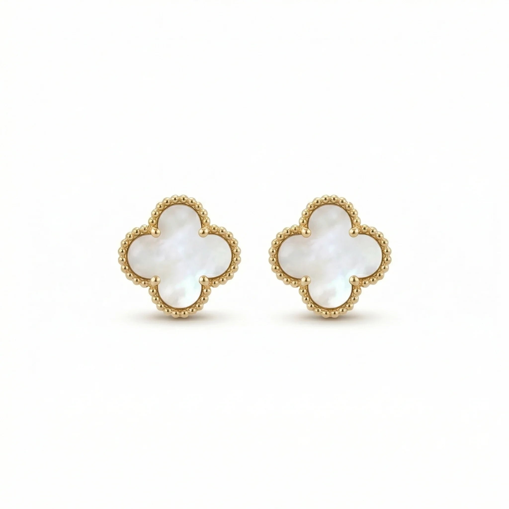 Gold clover stud earrings with mother of pearl inlay on white background