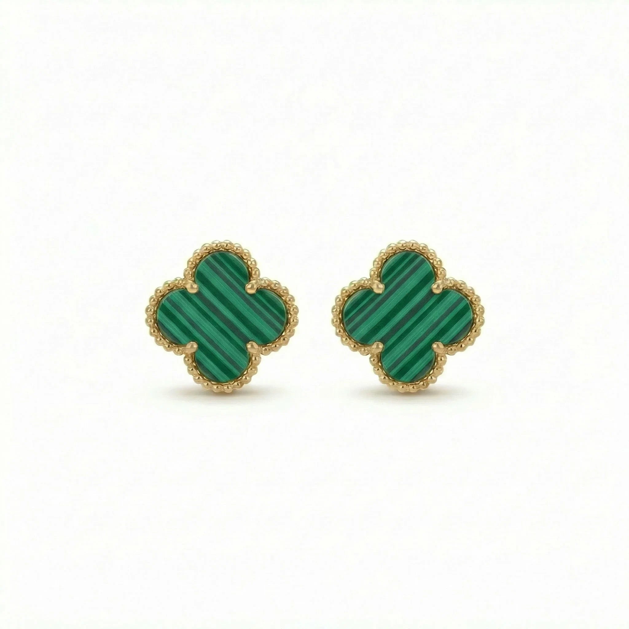 Gold and green malachite clover stud earrings with beaded edges on white background